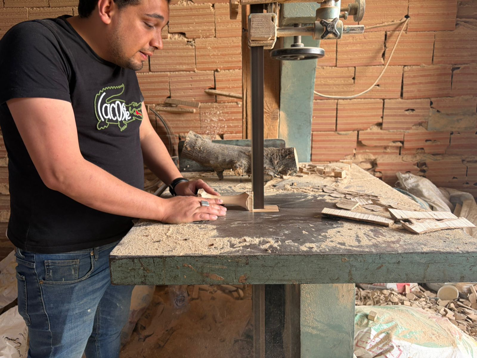 Artisan drilling a precise hole into a wooden chew